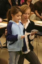 Mrs. Athorp assists a student.